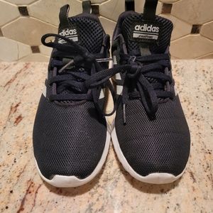 Boys size 4 1/2 black and white Adidas cloud foam sneakers.